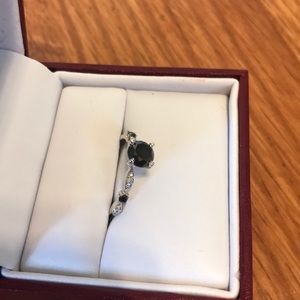 Black diamond and white pavé ring